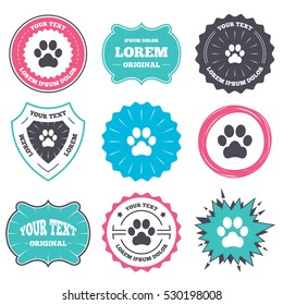 Label and badge templates. Dog paw sign icon. Pets symbol. Retro style banners, emblems. Vector