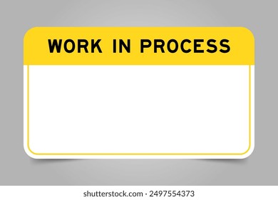 Label banner that have yellow headline with word work in process and white copy space, on gray background
