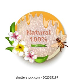 Label with drops of honey bees and flowers with the words 100% Natural