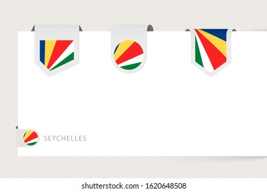 Label flag collection of Seychelles in different shape. Ribbon flag template of Seychelles hanging from paper or different surface.