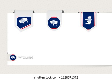 Label flag collection of US state Wyoming in different shape. Ribbon flag template of Wyoming hanging from paper or different surface.
