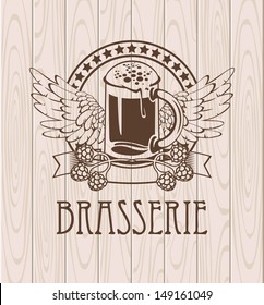 label with a glass of beer and wings on the background of the wooden planks and labeled Brewery