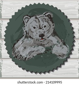 Label with the head of a brown bear on a wooden background. Hand drawn sketch