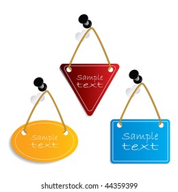 Labels hanging on push-pins