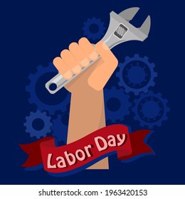 Concepto del Día del Trabajo con una llave ajustable para el hombre.