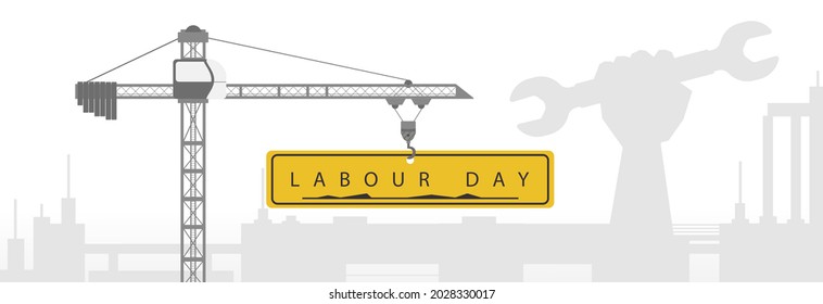 Labor Day, a crane on a construction site raises a sign reading Labor Day. 
