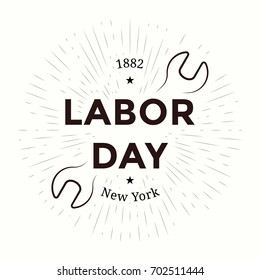 Labor day emblem. Isolated vector elements. Calligraphy, lettering design with radiance and wrench. Badges usable for greeting cards, posters, banners.