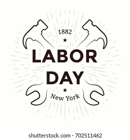 Labor day emblem. Isolated vector elements. Calligraphy, lettering design with radiance, hammers and wrenches. Badges usable for greeting cards, posters, banners.