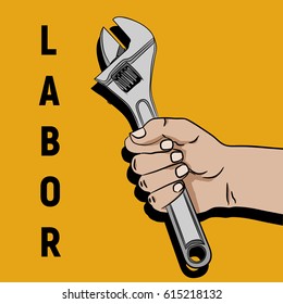 Labor day hand holding wrench