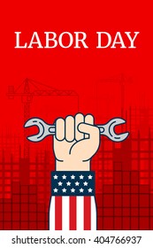 Labor day red poster with a hand in the jacket in the form of an American flag. The fist clamped spanner. Under construction skyscrapers and cranes in the background. Labor day text. Vector.