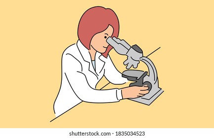 Laboratory assistant looking through microscope, scientists in medical laboratory doing research