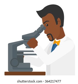 Laboratory assistant with microscope.