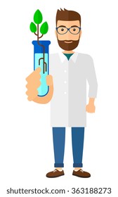 Auxiliar de laboratorio con tubo de ensayo.