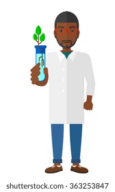 Auxiliar de laboratorio con tubo de ensayo.