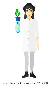 Auxiliar de laboratorio con tubo de ensayo.