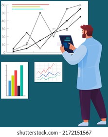 Laboratory assistant works with research creative test results, analyzes obtained experimental data. Male scientist stands near board with indicators, charts. Innovation idea, scientific development