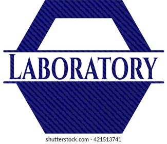 Emblema de laboratorio con fondo jean
