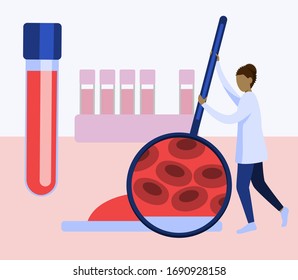 laboratory worker examines a blood sample.