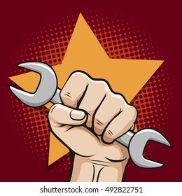 Labour day poster with working hand and wrench and bursting star. Vector illustration
