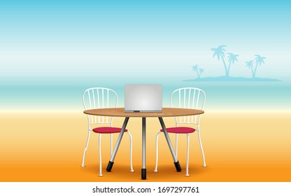 labtop on the wooden table and chair on the beach