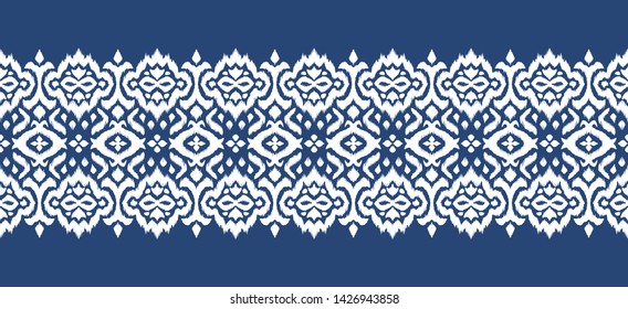 Lace border. Ikat seamless pattern. Vector tie dye shibori print with stripes and chevron. 