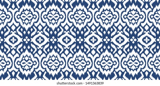Lace border. Ikat seamless pattern. Vector tie dye shibori print with stripes and chevron. 