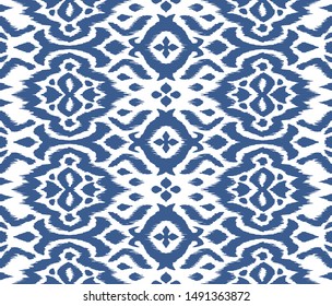 Lace border. Ikat seamless pattern. Vector tie dye shibori print with stripes and chevron. 