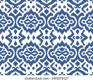 Lace border. Ikat seamless pattern. Vector tie dye shibori print with stripes and chevron. 