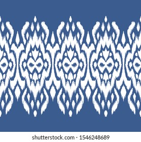 Lace border. Ikat seamless pattern. Vector tie dye shibori print with stripes and chevron. Ink textured japanese background. Ethnic fabric. Bohemian fashion. African creative. Damask rug.