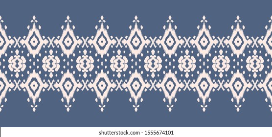 Lace border. Ikat seamless pattern. Vector tie dye shibori print with stripes and chevron. Ink textured japanese background. Ethnic fabric. Bohemian fashion. African creative. Damask rug. 