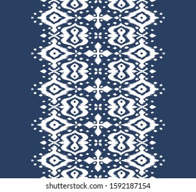 Lace border. Ikat seamless pattern. Vector tie dye shibori print with stripes and chevron. Ink textured japanese background. Ethnic fabric. Bohemian fashion. African creative. Damask rug. 