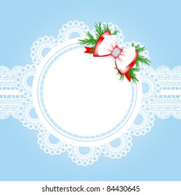 lace round frame with christmas decorative bow at blue background