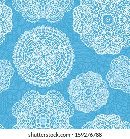 Lace seamless pattern with doilies on blue background