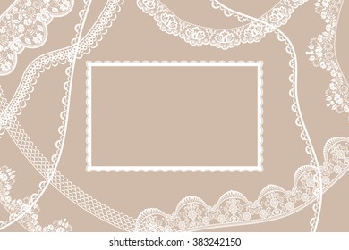 Lace white ribbons and frame on beige background