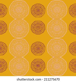 Lacy colored print. Vector seamless background with snowflakes. Yellow background.