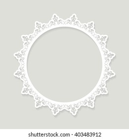 Lacy paper cut round frame. Doily.