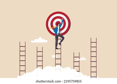 Ladder of success to reach goal or target, challenge to achieve goal, strategy or motivation to win competition, ambition or aspiration concept, businessman climb up the right ladder to reach goal.