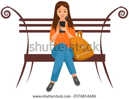 Lady with backpack sits on bench, chatting, communicating using electronic device. Woman talking by phone on bench. Girl uses modern technology to communicate. Girl in headphones sits with smartphone