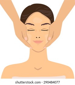 Lady get a relaxing of face massage.