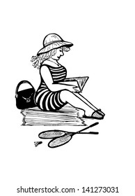 Lady reading on a beach
