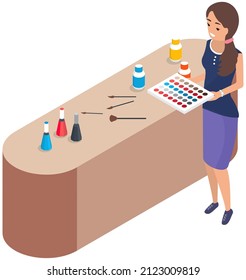 Lady standing near table with set of makeup tools and holding eyeshadow palette. Decorative cosmetics for face. Stand with elements of cosmetics for face beauty. Woman working as makeup artist