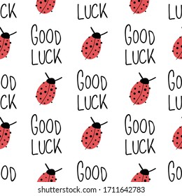 Ladybug and Good luck hand drawn lettering on white seamless vector pattern. Cute ladybug, Good Luck quote repeating fortune background. Use for New Years, fabrics, packaging