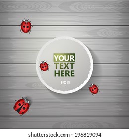 Ladybug on the wooden texture with paper label. Vector illustration for you design.