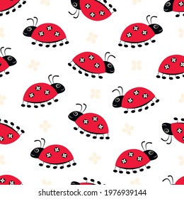 Ladybugs seamless pattern. Red cartoon beetles on a white background. Vector insects illustration. Bright childish design for fabric, packaging, cover.
