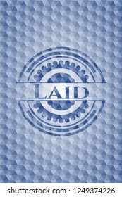 Laid blue emblem or badge with abstract geometric polygonal pattern background.