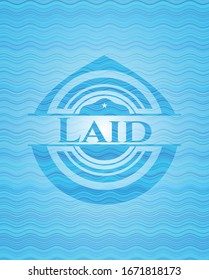 Laid light blue water wave badge background. Vector Illustration. Detailed.