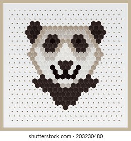 Laid out panda head of tiles of different colors on a special board for mosaic