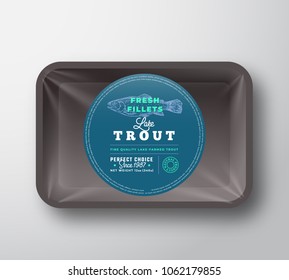 Lake Trout Fillets. Abstract Vector Fish Plastic Tray with Cellophane Cover Packaging Design Round Label or Sticker. Retro Typography and Hand Drawn Trout Silhouette Background Layout. Isolated.
