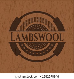 Lambswool badge with wooden background
