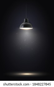 Lamp in dark room. Spotlight on black background. Place for text or product presentation.